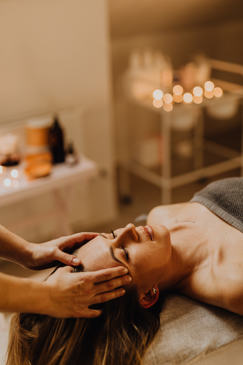 Client relaxing in a calm, softly lit treatment room at Sublime Salon & Spa in Newtown, Pennsylvania