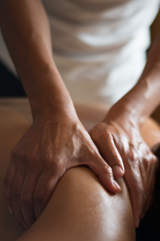 Massage therapist performing a relaxing full-body massage on a client at Sublime Salon & Spa in Newtown, Pennsylvania