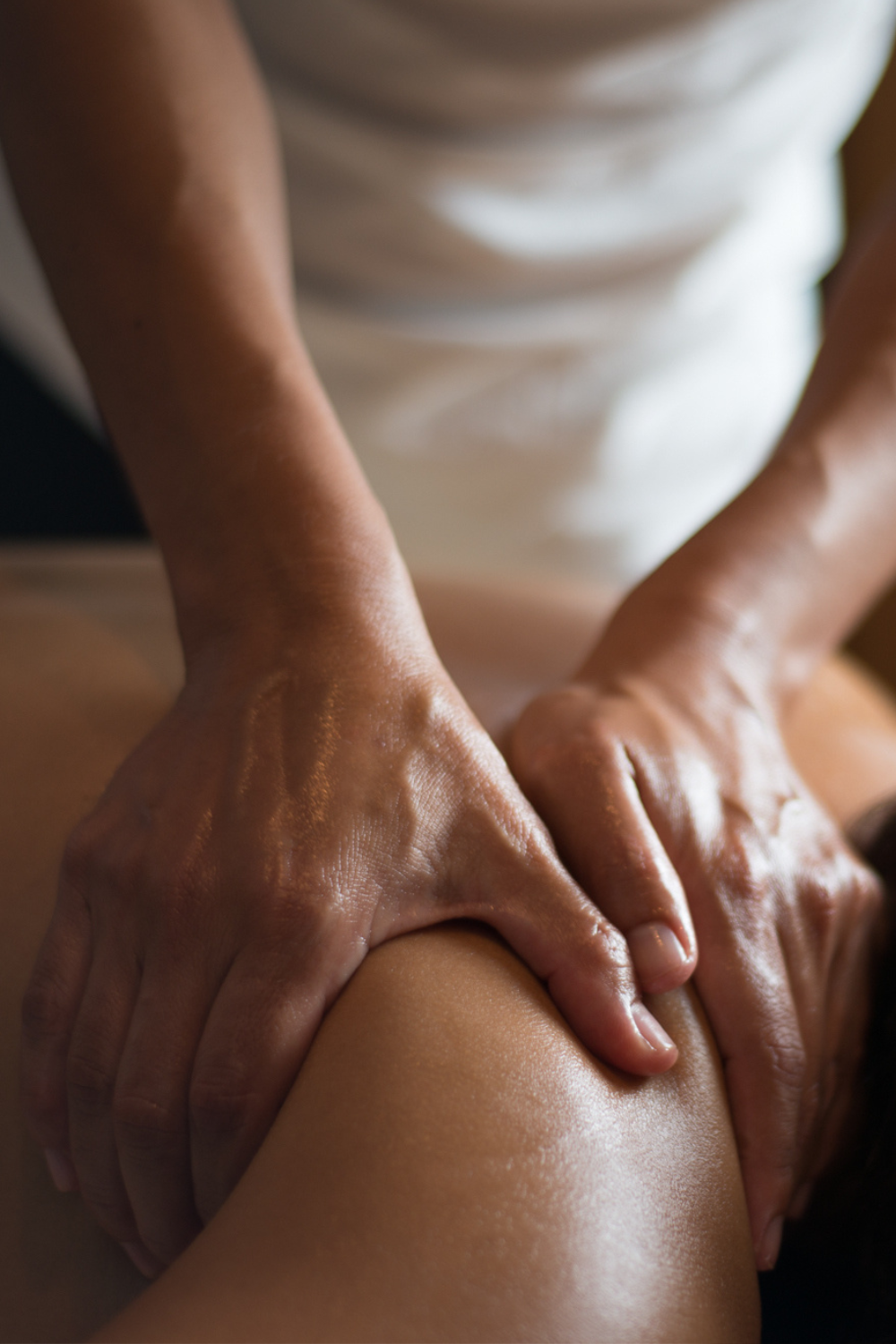 Massage therapist performing a relaxing full-body massage on a client at Sublime Salon & Spa in Newtown, Pennsylvania